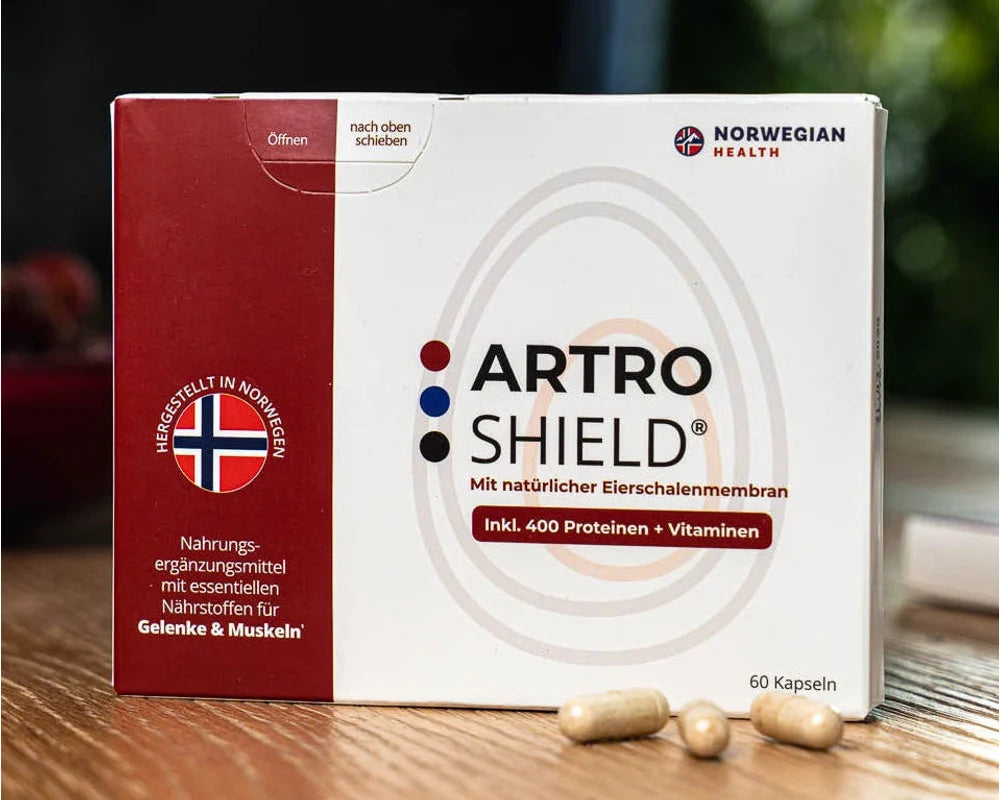 ArtroShield-Packung und Kapseln auf einem hellen Küchentisch